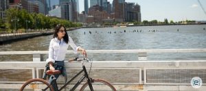 Woman Standing With Bicycle 900x400