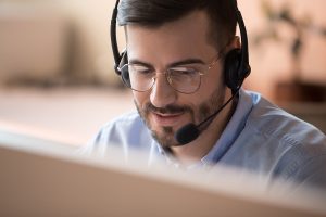 Focused Businessman Wear Wireless Headset Make Conference Video